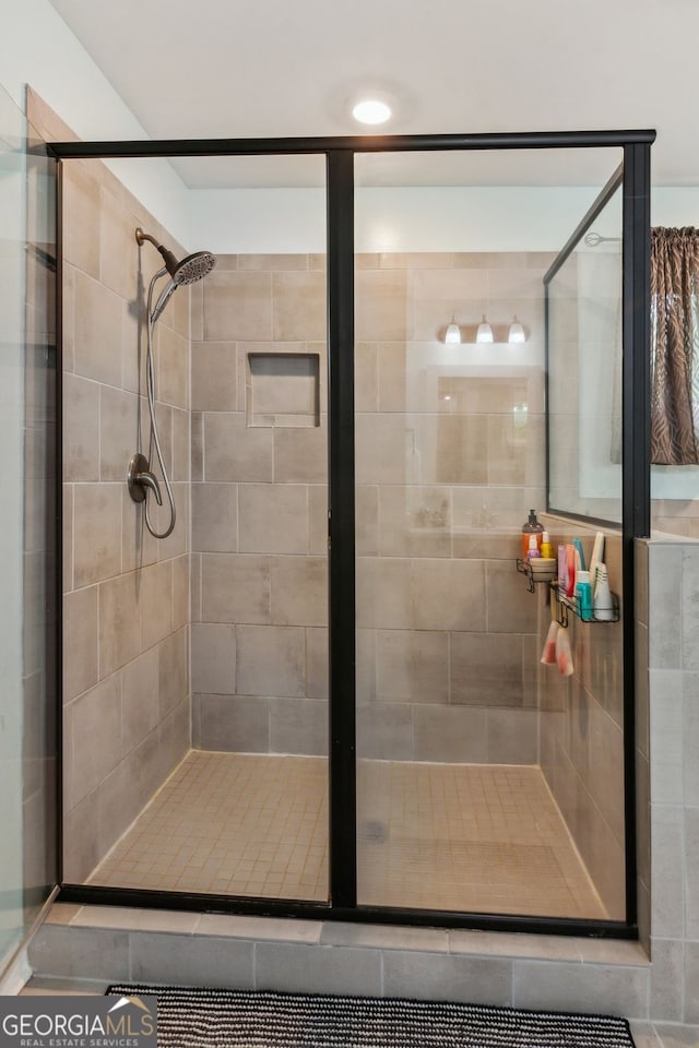 bathroom featuring a shower stall