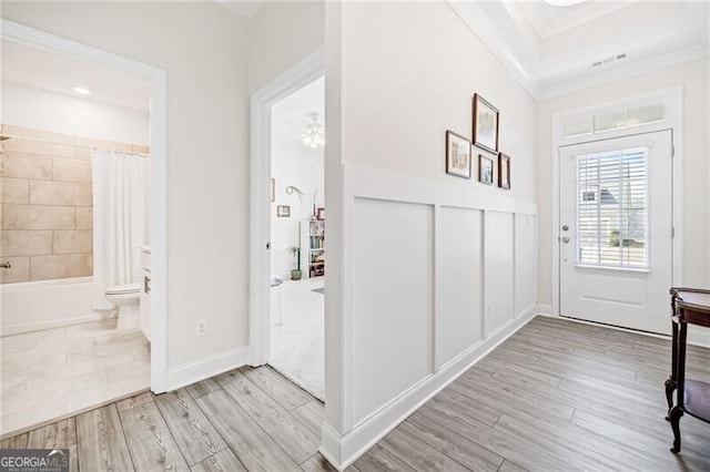 221 Hickory Bluffs Pkwy, Canton, GA 30114 - foyer featuring ornamental molding, wood finished floors, a ceiling fan, and visible vents