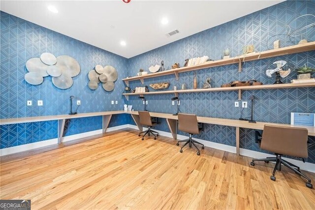 221 Hickory Bluffs Pkwy, Canton, GA 30114 - office featuring built in desk, visible vents, wallpapered walls, baseboards, and wood finished floors