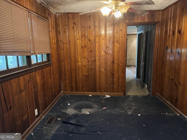 343 Academy Dr, Dallas, GA 30132 - empty room with ceiling fan, a textured ceiling, visible vents, baseboards, and wooden walls