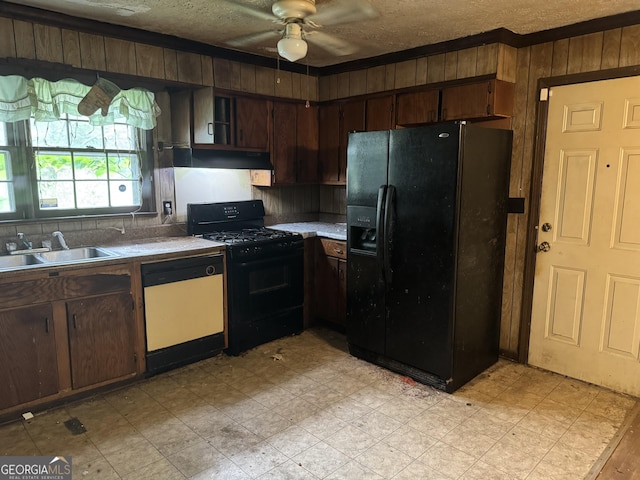 343 Academy Dr, Dallas, GA 30132 - kitchen featuring a sink, wood walls, a ceiling fan, under cabinet range hood, and black appliances