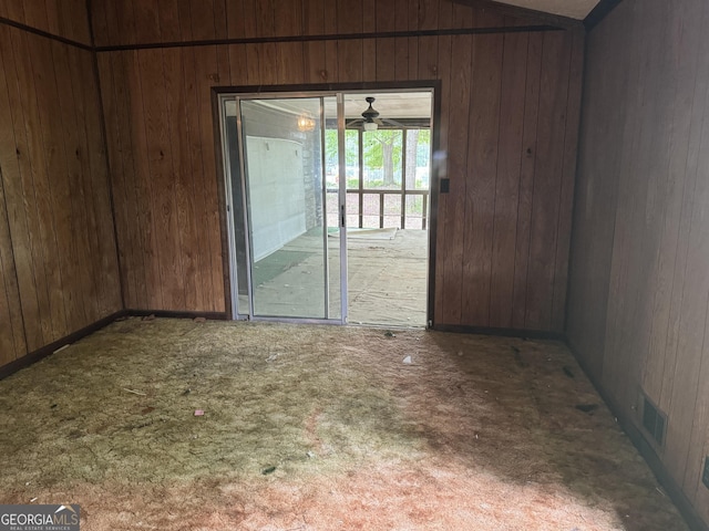 343 Academy Dr, Dallas, GA 30132 - carpeted empty room featuring wood walls