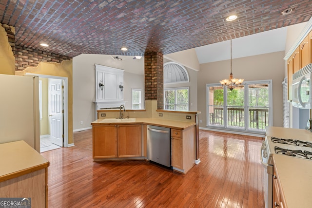 9255 Old Preserve Trl, Ball Ground, GA 30107 - kitchen with white appliances, light wood-style flooring, a chandelier, light countertops, and pendant lighting
