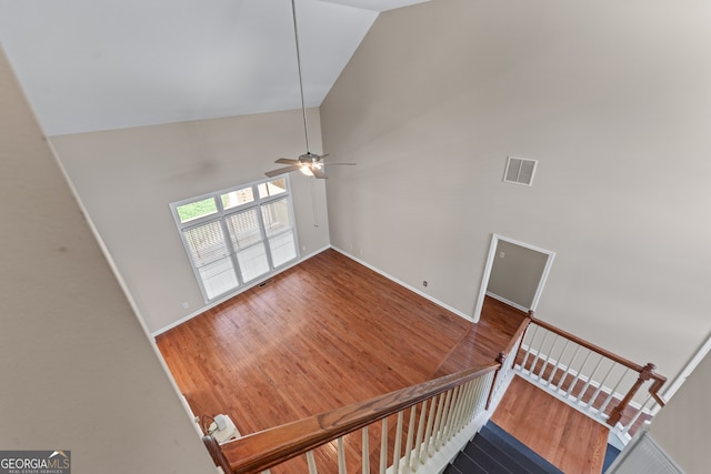 9255 Old Preserve Trl, Ball Ground, GA 30107 - staircase featuring high vaulted ceiling, a ceiling fan, and wood finished floors