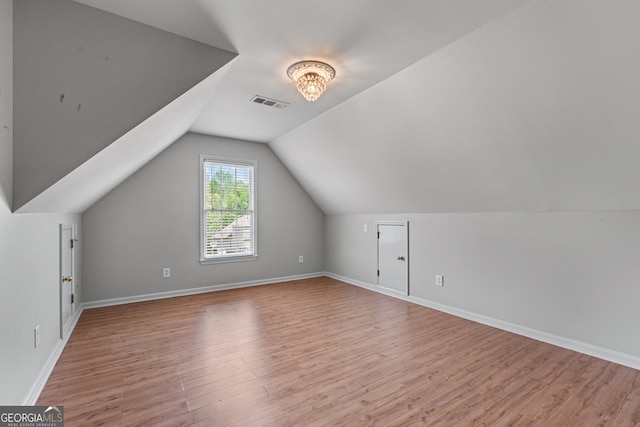 9255 Old Preserve Trl, Ball Ground, GA 30107 - additional living space featuring light wood-type flooring and lofted ceiling