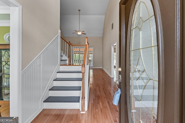 9255 Old Preserve Trl, Ball Ground, GA 30107 - foyer with a ceiling fan, stairs, hardwood / wood-style flooring, and a high ceiling