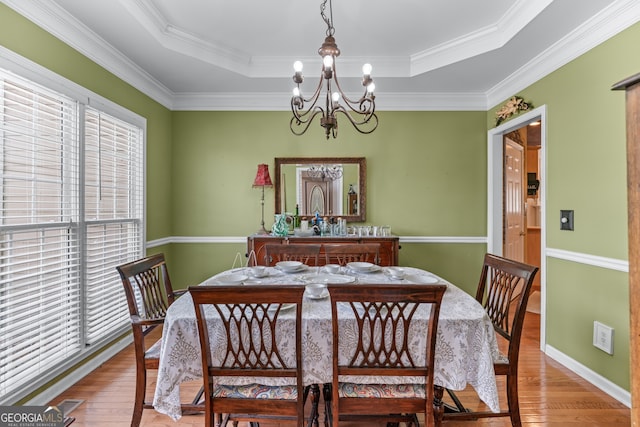 9255 Old Preserve Trl, Ball Ground, GA 30107 - dining area featuring a chandelier, hardwood / wood-style floors, a tray ceiling, and ornamental molding