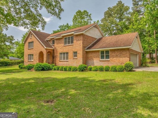 208 Earlwood Dr, Dublin, GA 31021 - view of front of house with a front lawn, an attached garage, concrete driveway, and brick siding
