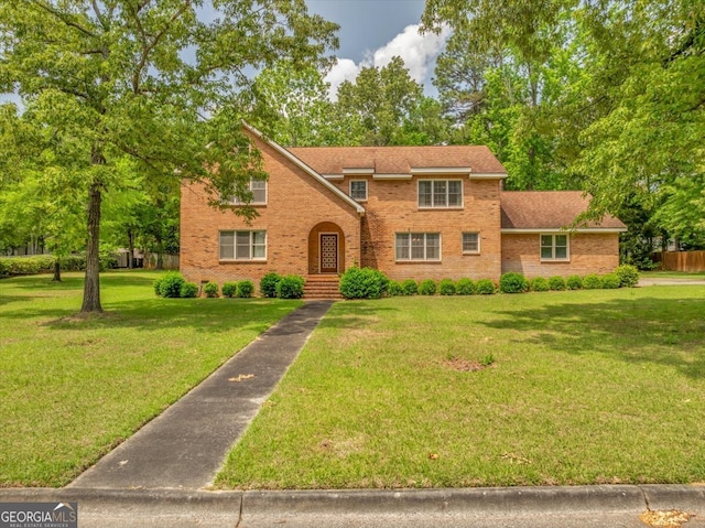 208 Earlwood Dr, Dublin, GA 31021 - traditional-style house featuring brick siding and a front yard
