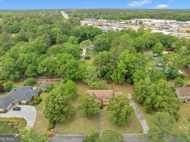 drone / aerial view with a view of trees