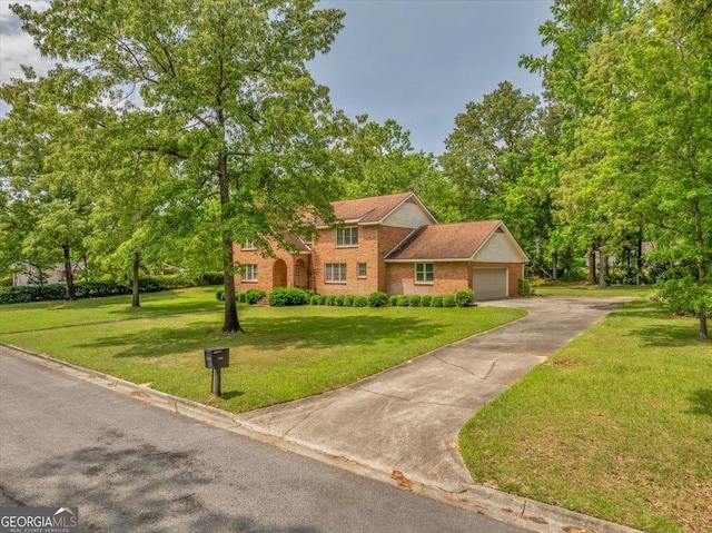view of front facade featuring a garage, brick siding, driveway, and a front yard