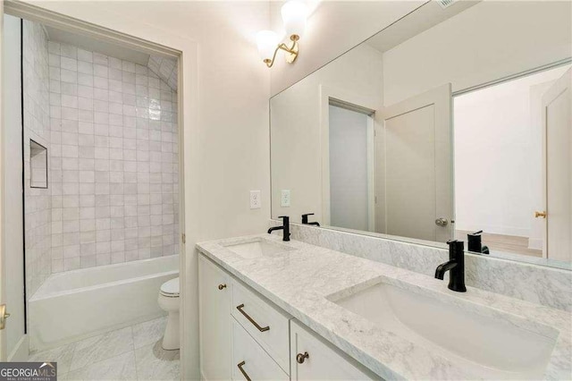 3006 Skyland Dr NE, Brookhaven, GA 30341 - bathroom with toilet, double vanity, a sink, and bathtub / shower combination