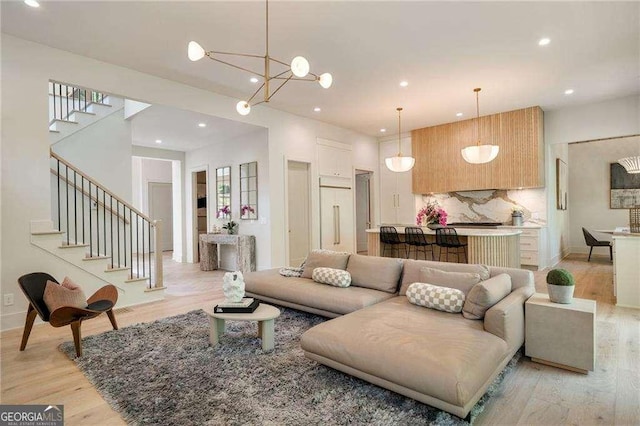 3006 Skyland Dr NE, Brookhaven, GA 30341 - living room with baseboards, light wood-type flooring, stairs, and recessed lighting