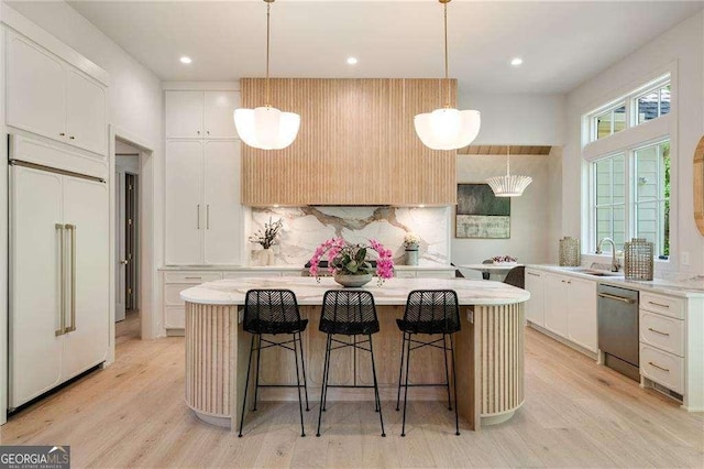 3006 Skyland Dr NE, Brookhaven, GA 30341 - kitchen with decorative backsplash, paneled built in fridge, a center island, light countertops, and dishwasher
