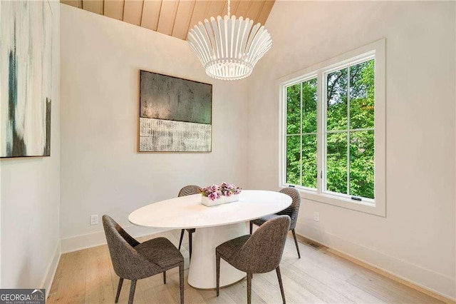 3006 Skyland Dr NE, Brookhaven, GA 30341 - dining space with a notable chandelier, plenty of natural light, light wood-style flooring, and baseboards