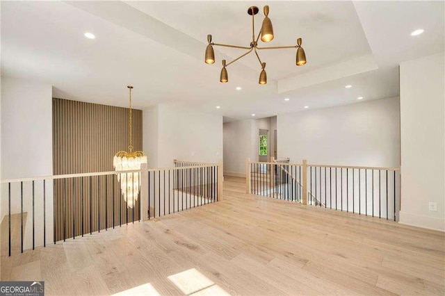 3006 Skyland Dr NE, Brookhaven, GA 30341 - spare room featuring recessed lighting, a notable chandelier, wood finished floors, and baseboards