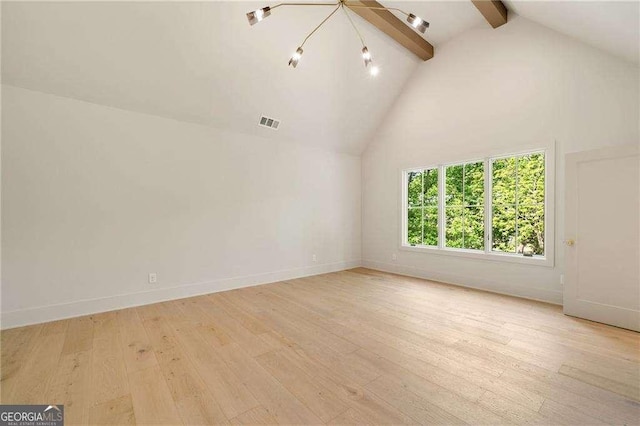 3006 Skyland Dr NE, Brookhaven, GA 30341 - unfurnished living room with baseboards, light wood-style flooring, a chandelier, beam ceiling, and high vaulted ceiling