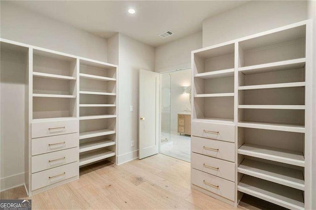 3006 Skyland Dr NE, Brookhaven, GA 30341 - spacious closet with visible vents and light wood finished floors