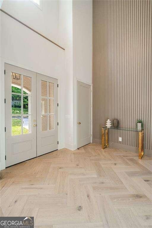 3006 Skyland Dr NE, Brookhaven, GA 30341 - foyer entrance featuring a high ceiling and baseboards