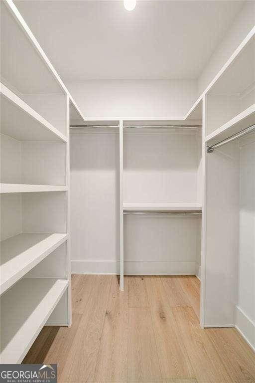 3006 Skyland Dr NE, Brookhaven, GA 30341 - walk in closet featuring light wood-style floors