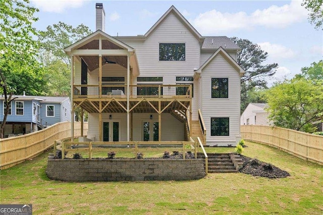 3006 Skyland Dr NE, Brookhaven, GA 30341 - rear view of property featuring a fenced backyard, a lawn, a ceiling fan, a chimney, and a deck