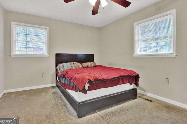 4850 Forest Blvd, Gainesville, GA 30506 - carpeted bedroom featuring baseboards, visible vents, and ceiling fan