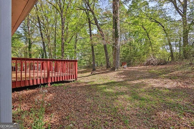 4850 Forest Blvd, Gainesville, GA 30506 - view of yard with a wooden deck and a wooded view