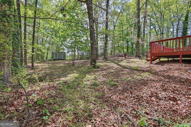 4850 Forest Blvd, Gainesville, GA 30506 - view of yard featuring a storage shed, a wooden deck, and an outdoor structure