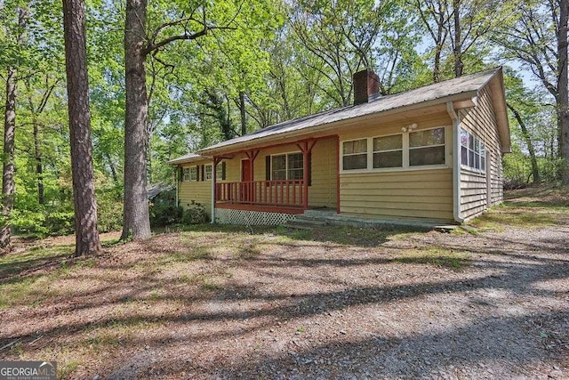 4850 Forest Blvd, Gainesville, GA 30506 - view of front of property with a chimney, metal roof, and a porch