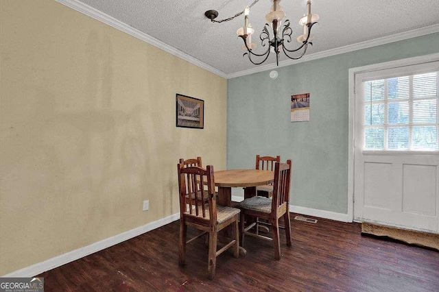 4850 Forest Blvd, Gainesville, GA 30506 - dining area featuring wood finished floors, a chandelier, baseboards, visible vents, and crown molding