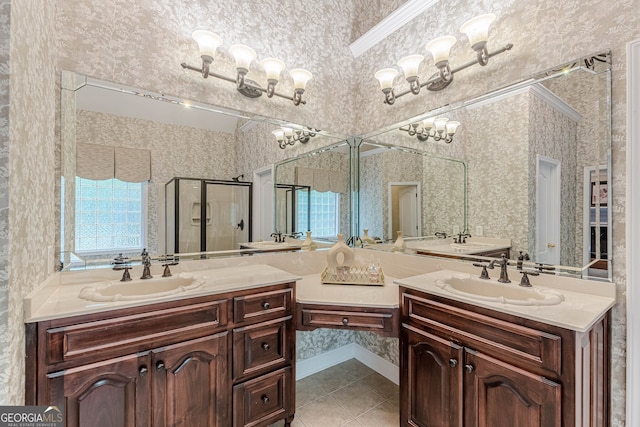 full bath with a shower stall, vanity, wallpapered walls, and tile patterned floors