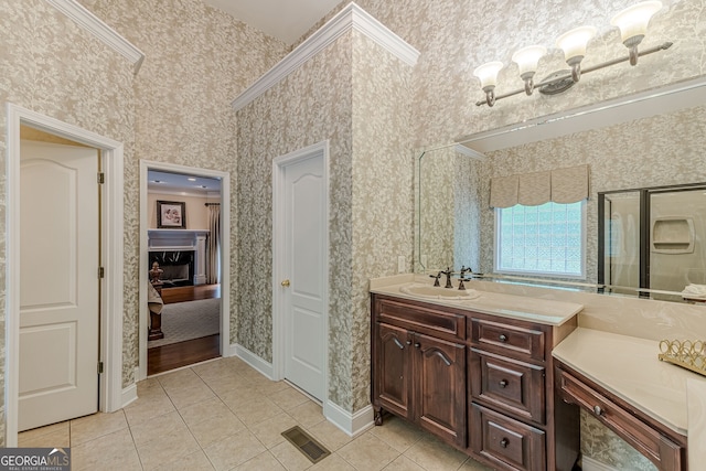 bathroom with tile patterned flooring, visible vents, wallpapered walls, and vanity