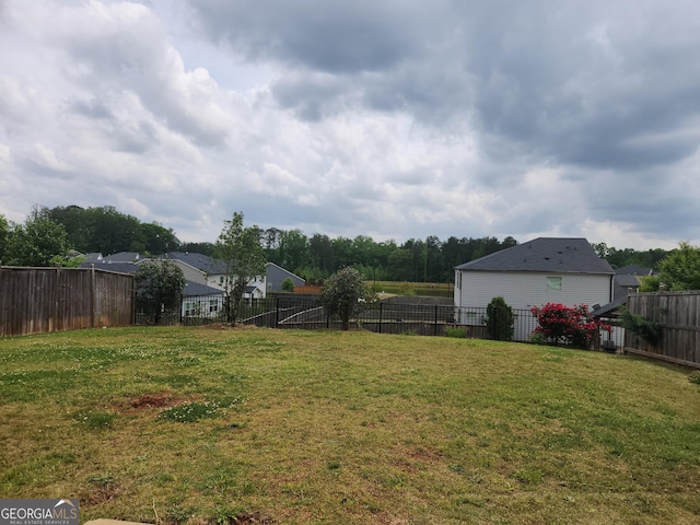view of yard with a fenced backyard