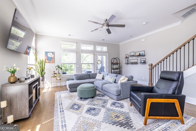 834 S Columbia Dr, Decatur, GA 30030 - living room featuring wood finished floors, baseboards, a ceiling fan, stairway, and ornamental molding