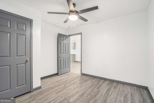 1477 Olive St SW, Atlanta, GA 30310 - unfurnished bedroom featuring light wood-style floors, baseboards, and a ceiling fan
