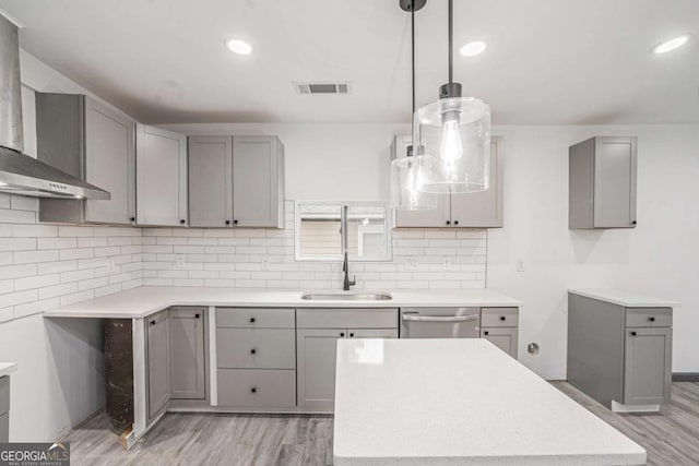 1477 Olive St SW, Atlanta, GA 30310 - kitchen featuring wall chimney exhaust hood, gray cabinets, light wood-type flooring, a sink, and recessed lighting