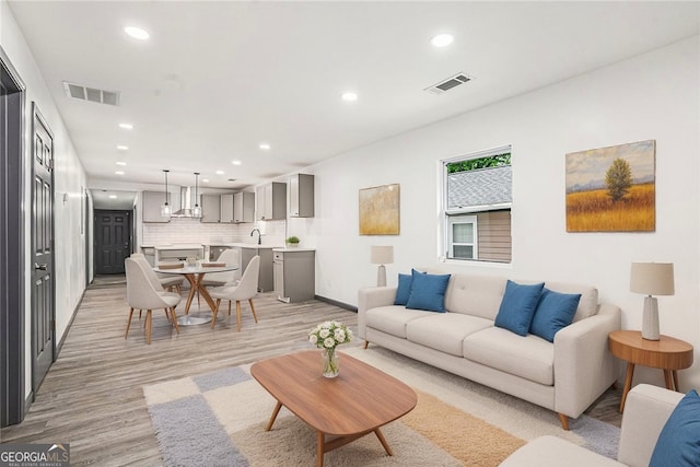 1477 Olive St SW, Atlanta, GA 30310 - living room featuring recessed lighting, light wood-style flooring, and baseboards