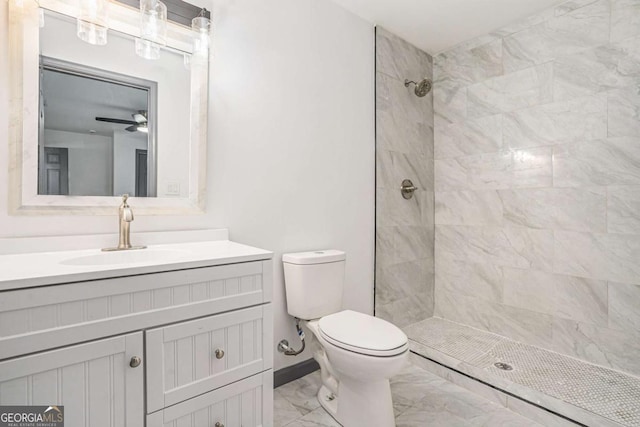 1477 Olive St SW, Atlanta, GA 30310 - bathroom with marble finish flooring, toilet, tiled shower, vanity, and a ceiling fan