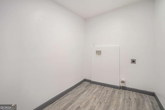 1477 Olive St SW, Atlanta, GA 30310 - clothes washing area featuring electric dryer hookup, light wood-type flooring, baseboards, and hookup for a washing machine
