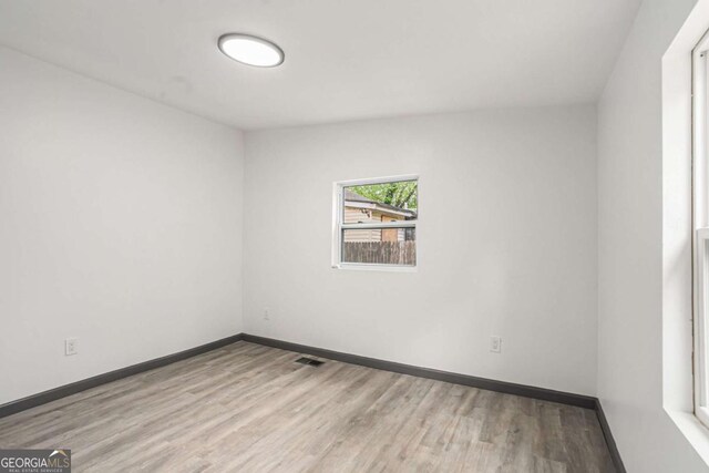 1477 Olive St SW, Atlanta, GA 30310 - unfurnished room featuring wood finished floors and baseboards