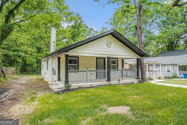 1477 Olive St SW, Atlanta, GA 30310 - view of front of home featuring covered porch and a chimney