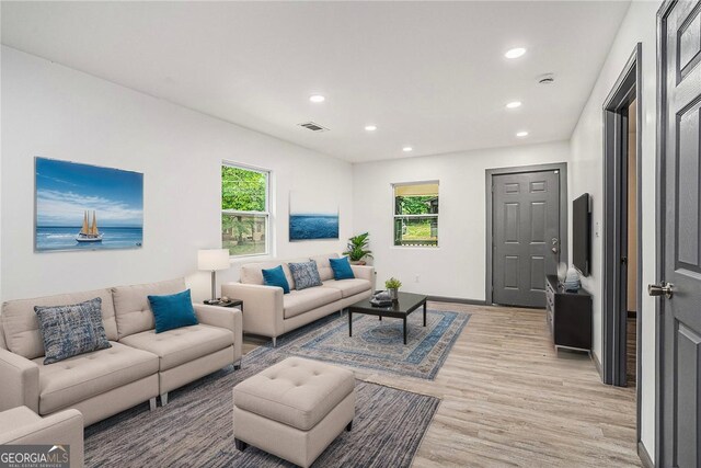 1477 Olive St SW, Atlanta, GA 30310 - living room featuring light wood-style floors, recessed lighting, and baseboards