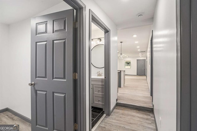 1477 Olive St SW, Atlanta, GA 30310 - hallway with baseboards, light wood finished floors, a sink, and recessed lighting
