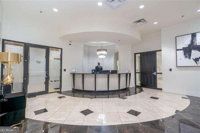 3040 Peachtree Rd NW Unit 815, Atlanta, GA 30305 - reception with recessed lighting, a chandelier, and arched walkways