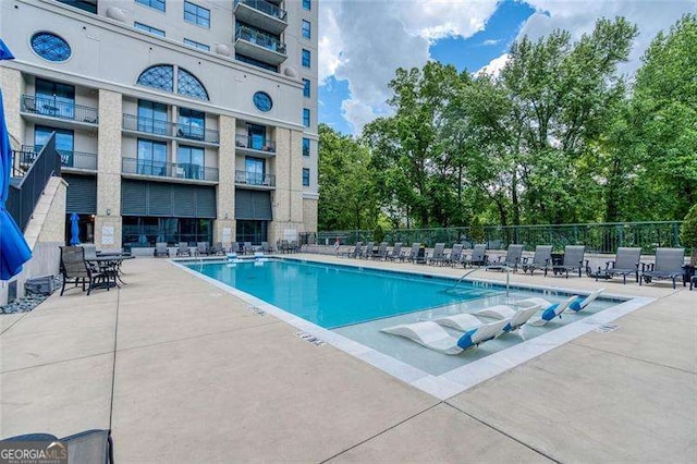 3040 Peachtree Rd NW Unit 815, Atlanta, GA 30305 - community pool with fence and a patio area