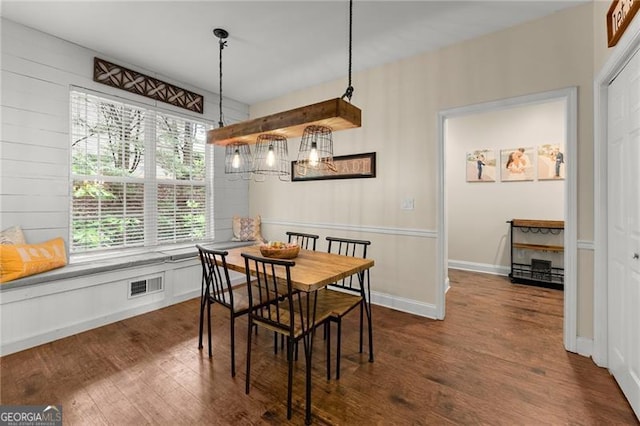 dining area with visible vents and dark wood finished floors