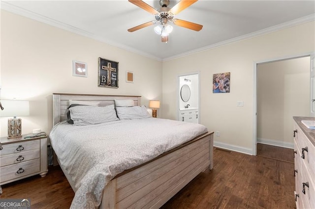 bedroom featuring dark wood-style flooring, ensuite bath, crown molding, a ceiling fan, and baseboards