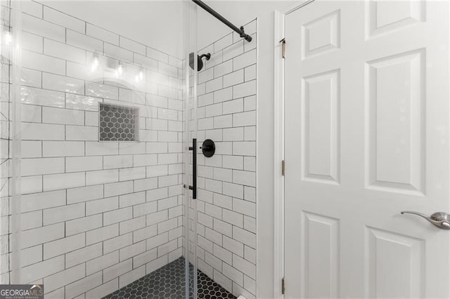 bathroom with a shower stall