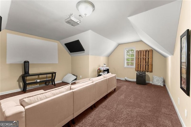 living room with carpet flooring, vaulted ceiling, and baseboards