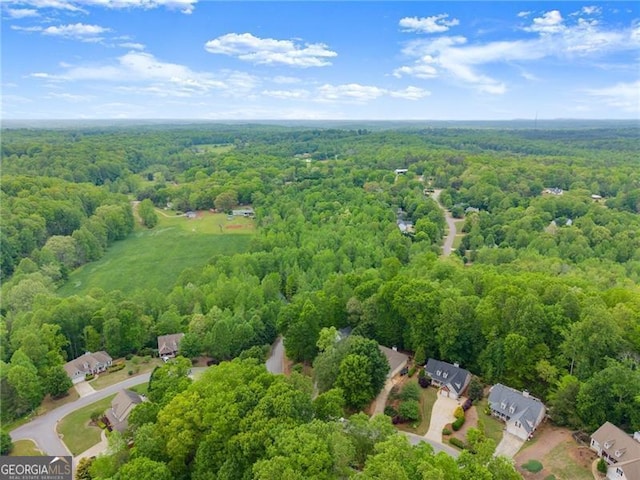 aerial view featuring a view of trees